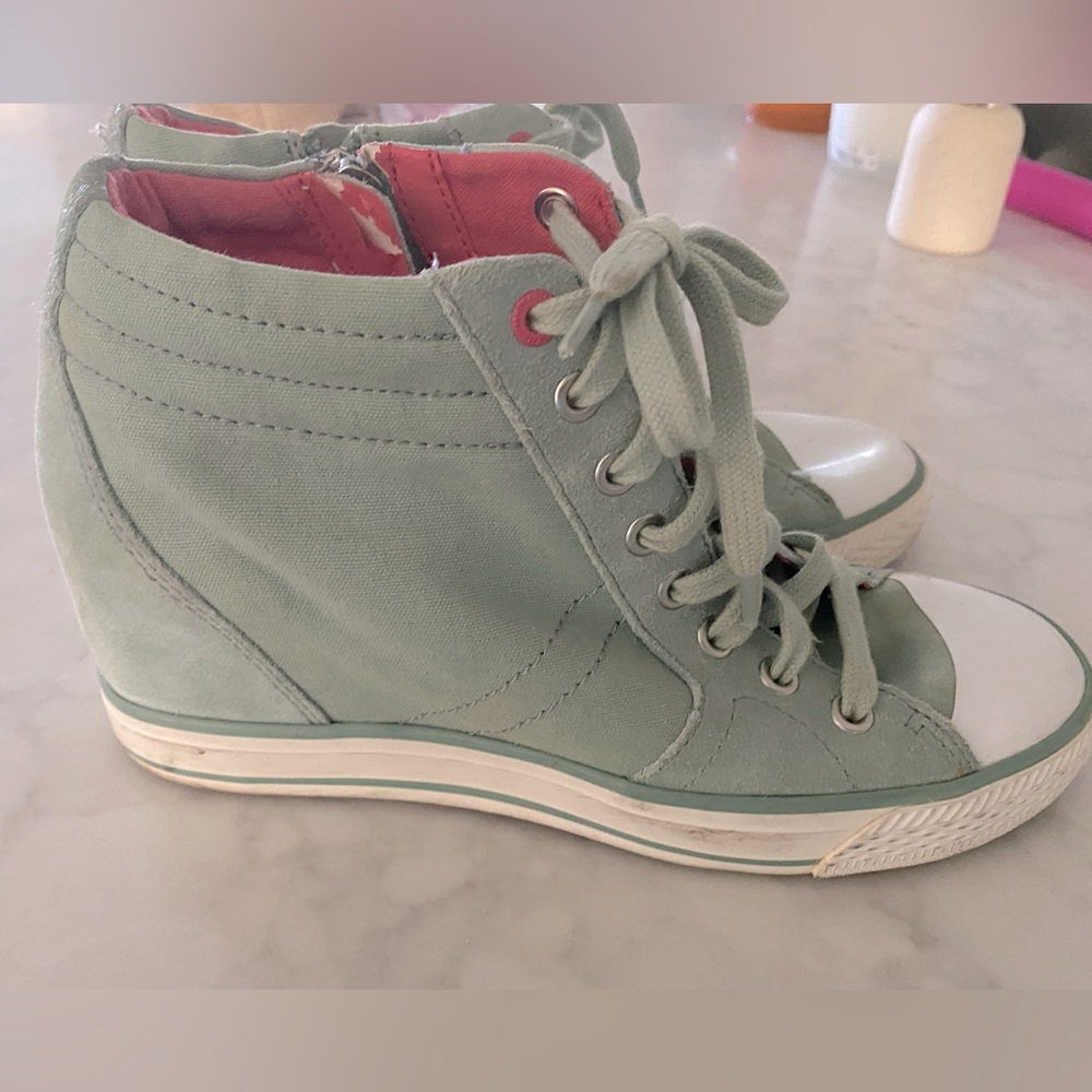 DKNY high top sneakers.  Excellent condition, very little wear.